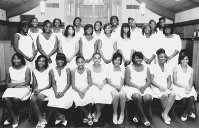 Sunlight Club members group portrait in white shirts