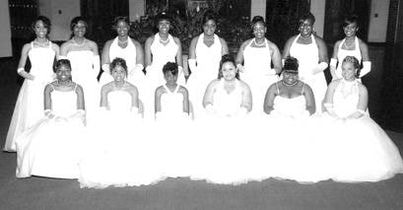 Bridesmaids in white dresses formal portrait