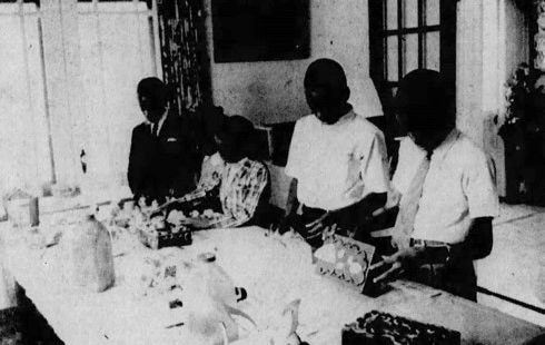People working at table with materials