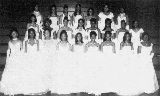 Large group of women in white formal gowns
